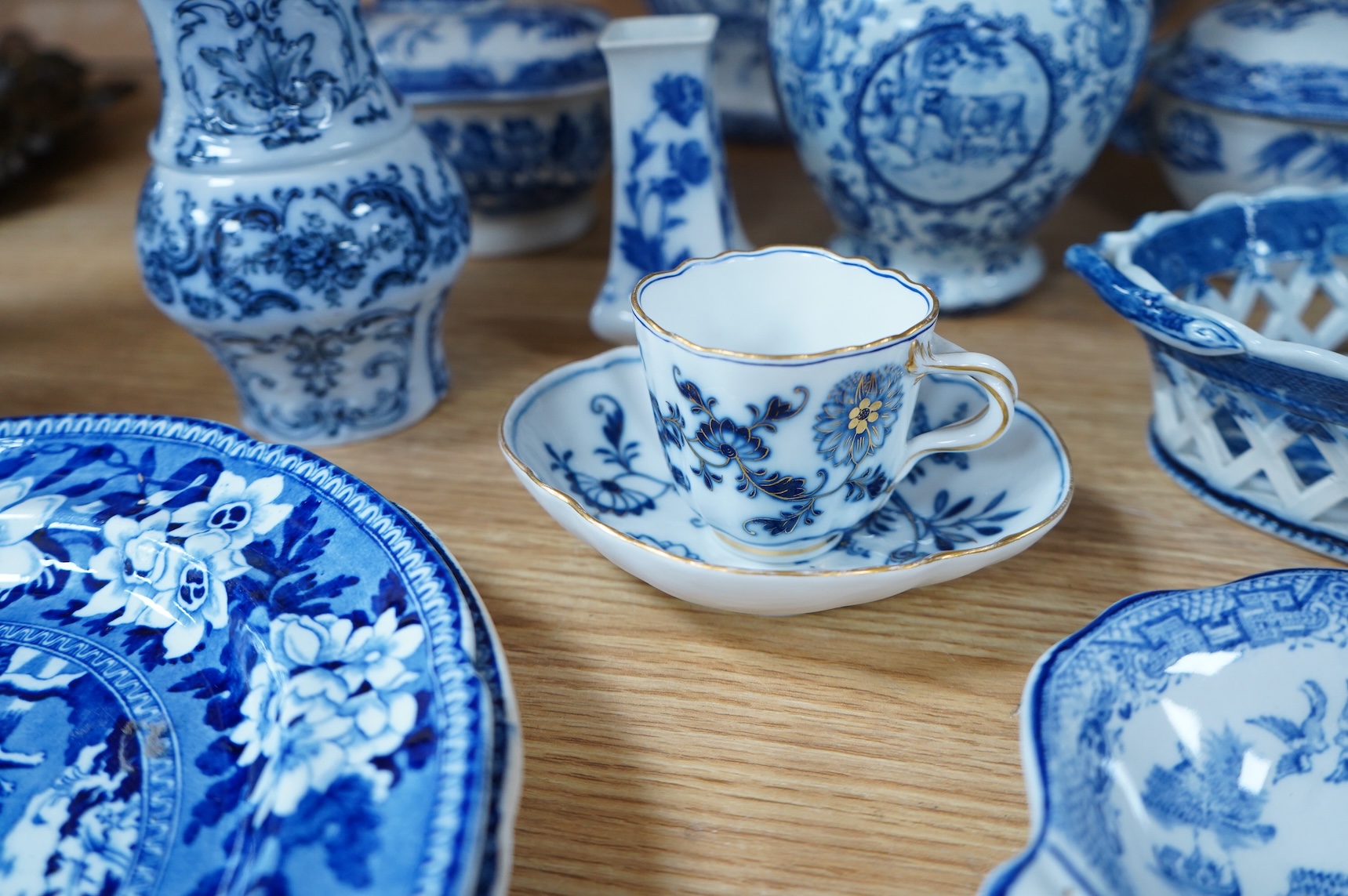A group of blue and white Willow pattern china, 19th century and later and a Meissen cup and. Saucer. (12).